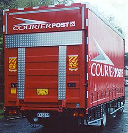 Curtainsider with tail lift acting as door